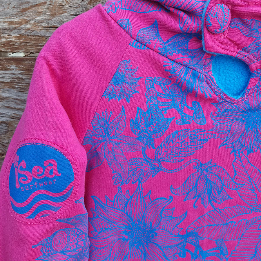 Kid's reversible hoody in turquoise/cerise - Close up Kid's reversible hoody in turquoise/cerise - close up